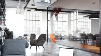 Modern office room for rest with transparent glass walls, dark table and laptop above, dark chairs and and black book rack, 3d rendering